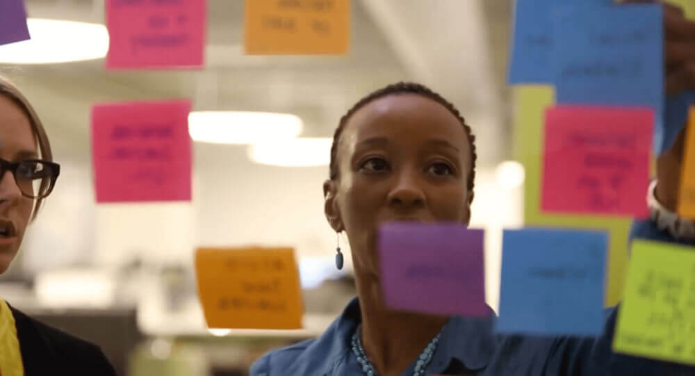 Person looking at sticky notes