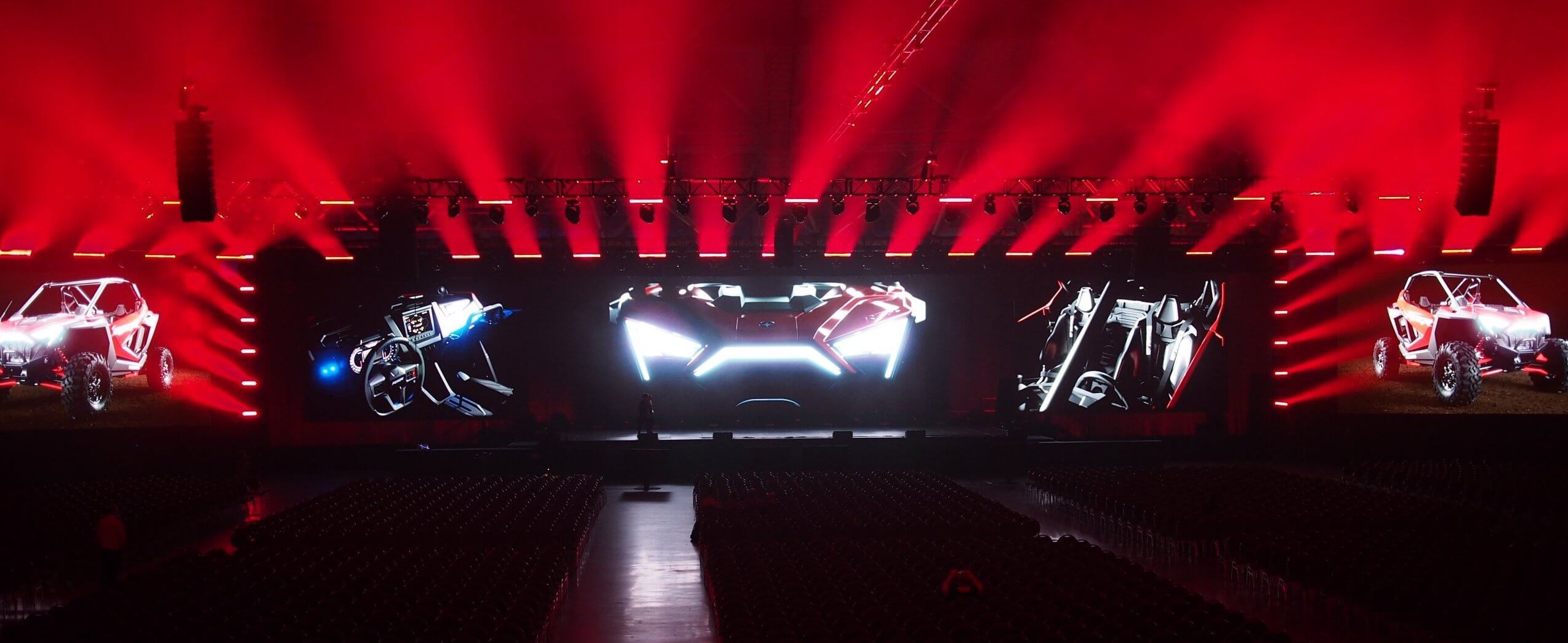 Full view of stage with red spotlights fanning out
