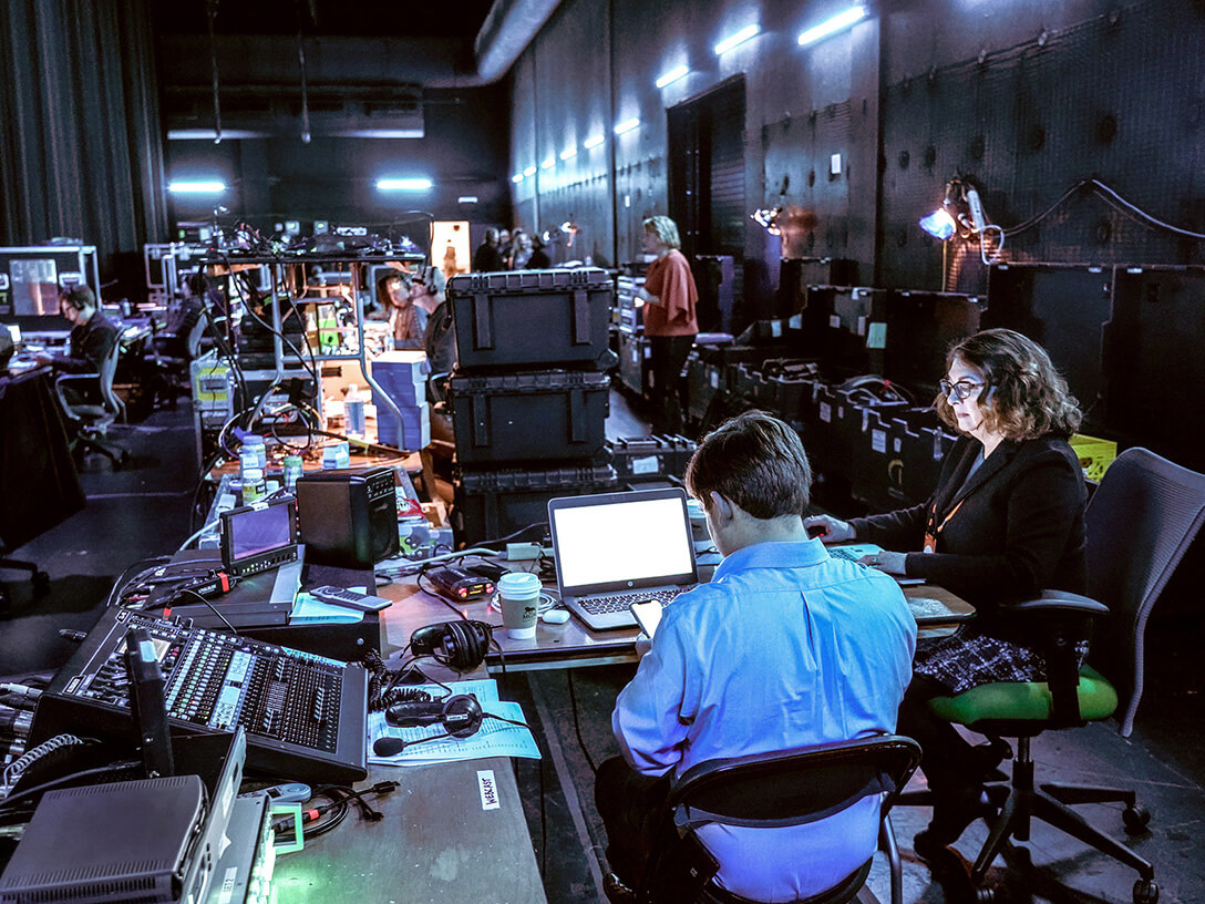 People working on an event backstage